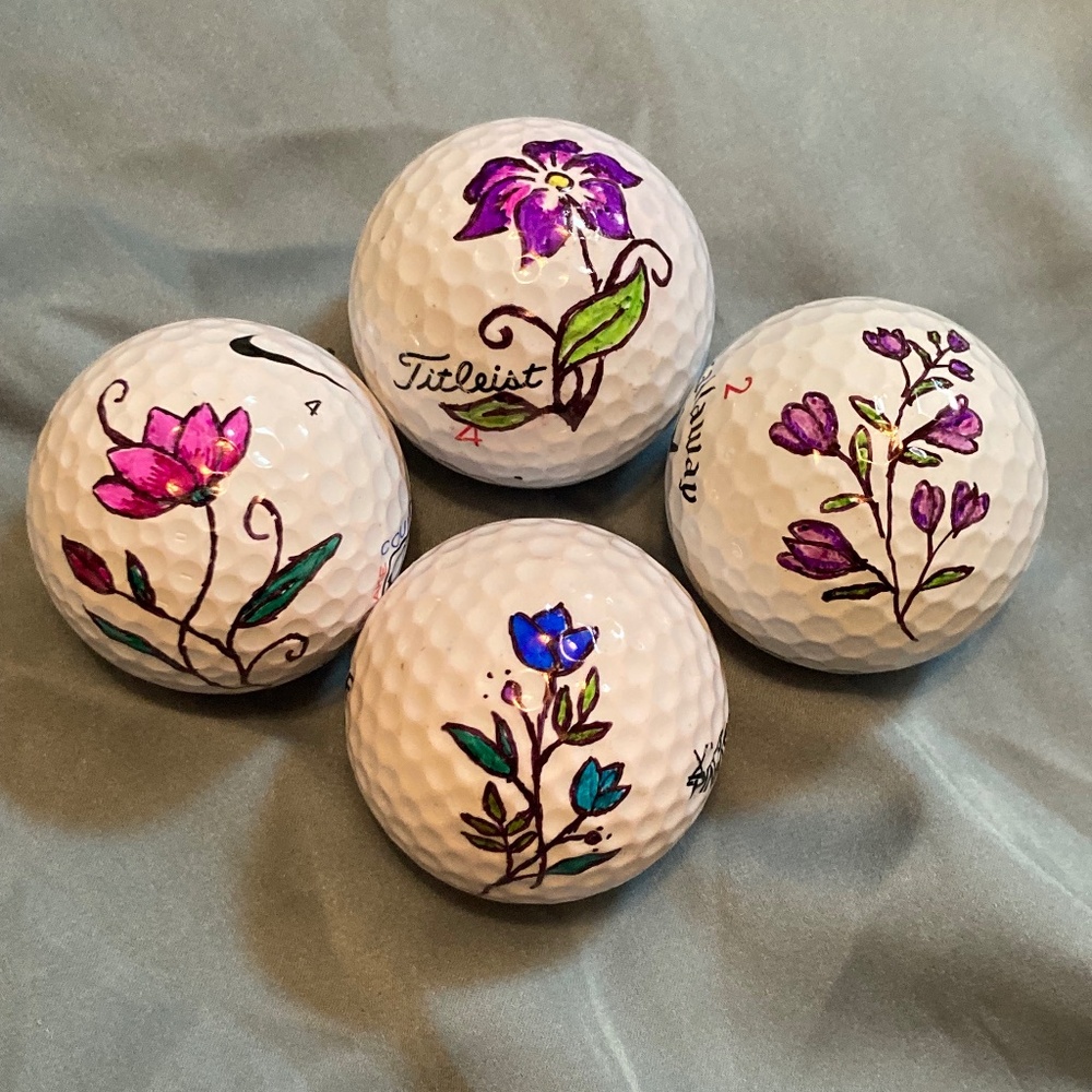 Hand drawn floral golf balls